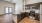 Spacious and well lit kitchen with wood flooring and stainless steel appliances