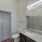 Bathroom with vanity and lighted mirror